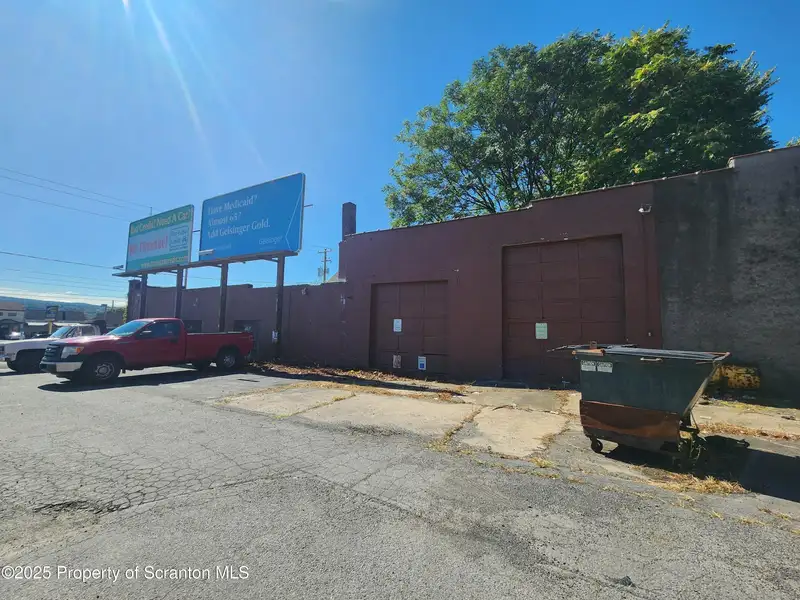Versatile Commercial Property with Garage Bays and Billboard Income in Prime Location