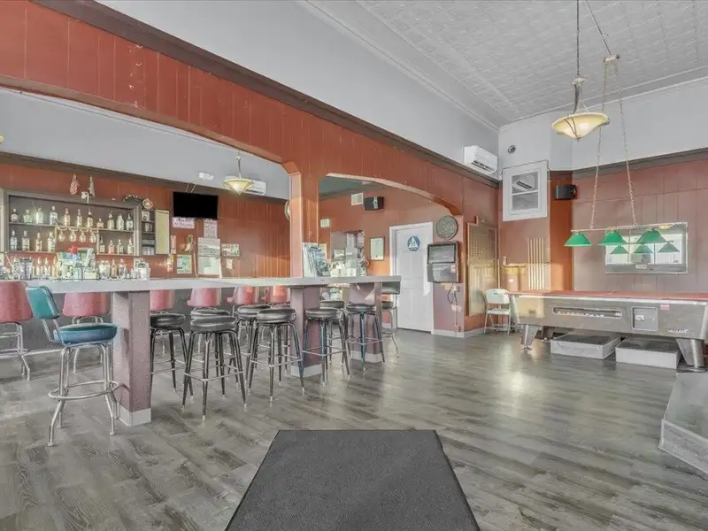 Versatile Corner Commercial Property with Retail Space and Two Apartments in Prime Location