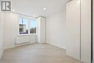 Renovated 2nd Floor Condo in Mid-town Toronto with Luxury Finishes and Modern Amenities