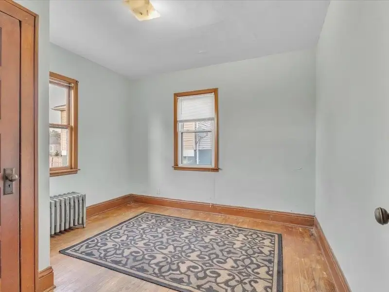 Versatile Corner Commercial Property with Retail Space and Two Apartments in Prime Location