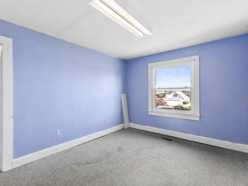 Versatile 4,305 Sq Ft Office Building with Apartment on Highway 11e