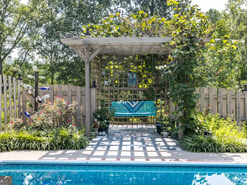 27 Acres with 2,400 Sq. Ft. Home, Duplexes, Pool, and Barn in Prime Location