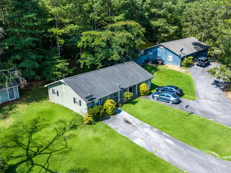 27 Acres with 2,400 Sq. Ft. Home, Duplexes, Pool, and Barn in Prime Location