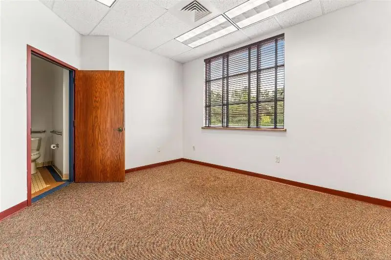 Versatile Commercial Condo for Sale Near Hwy 151 & 41 with Multiple Offices and Amenities