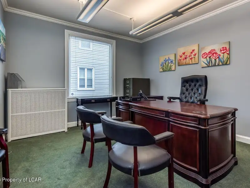 Versatile Office Building in Central Kingston with Multiple Offices and Ample Parking