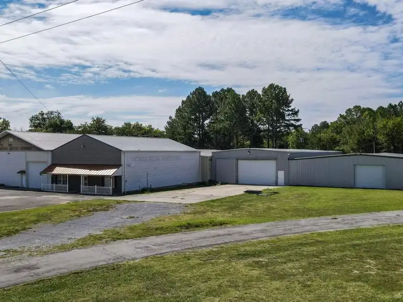 Commercial Property on Busy Highway - 2.1 Acres, 31,000 Sq Ft with Offices and Roll-up Doors