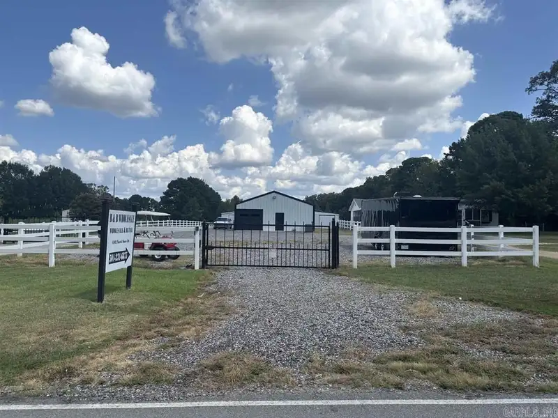 Fenced Commercial Building with Office Space Near Interstate