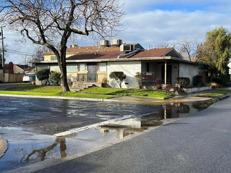 Versatile Office Space on Corner Lot with Ample Parking in Central Location
