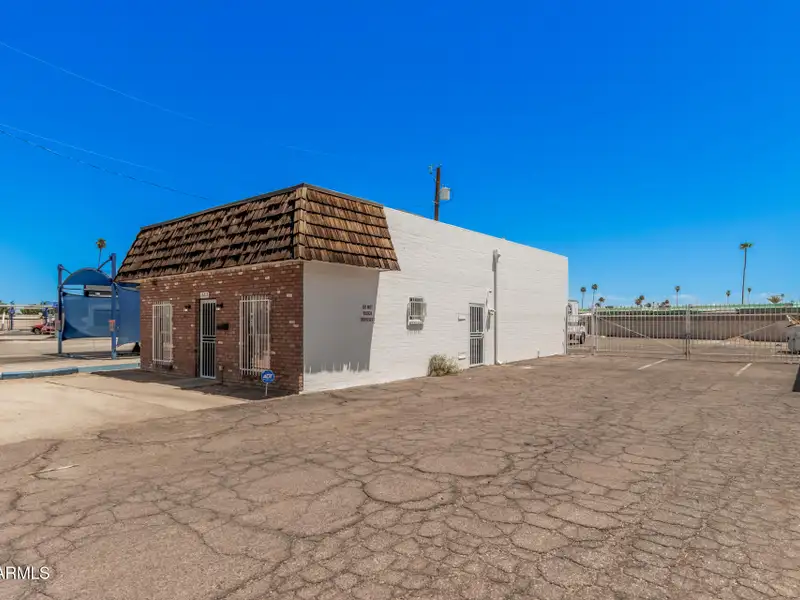 Versatile Commercial Property with Two Buildings and Ample Parking in Prime Location