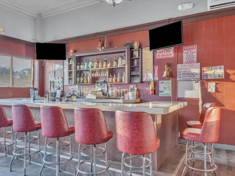 Versatile Corner Commercial Property with Retail Space and Two Apartments in Prime Location