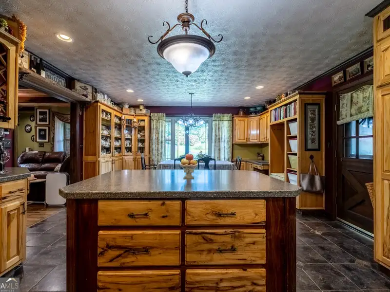 27 Acres with 2,400 Sq. Ft. Home, Duplexes, Pool, and Barn in Prime Location