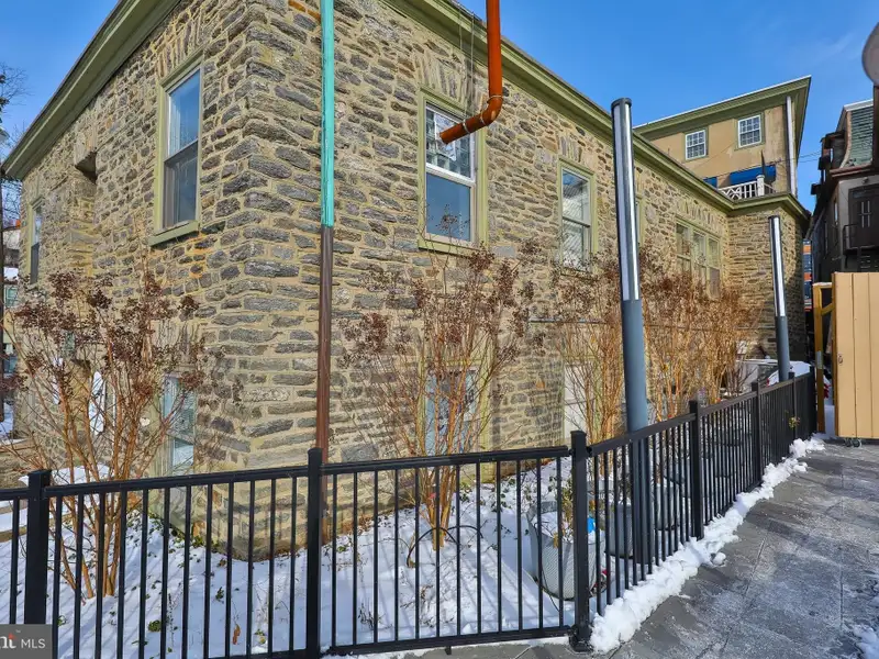 Historic Multi-use Building in Chestnut Hill Business District with Retail and Residential Units