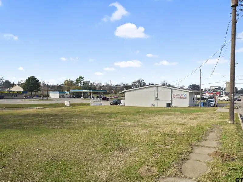 Prime Commercial Property with Building and Home on Half Acre Lot