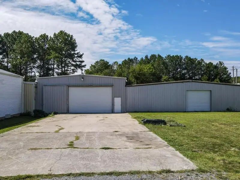 Commercial Property on Busy Highway - 2.1 Acres, 31,000 Sq Ft with Offices and Roll-up Doors