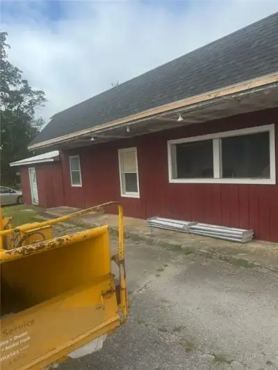 Multi-parcel Investment: Residential Home, Commercial Property, and Undeveloped Lot on Busy Highway
