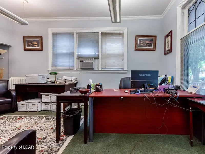 Versatile Office Building in Central Kingston with Multiple Offices and Ample Parking