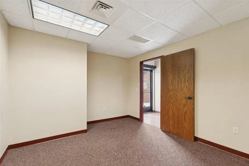 Versatile Commercial Condo for Sale Near Hwy 151 & 41 with Multiple Offices and Amenities