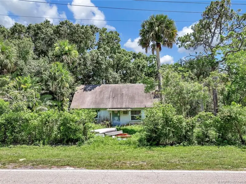 Commercial Corner Lot with Existing Residence in Lakewood Park, 31,140 Sq Ft