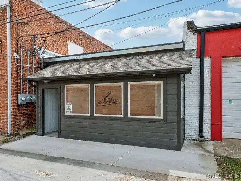 Historic Office Building with 9 Private Suites and Conference Room in Prime Location