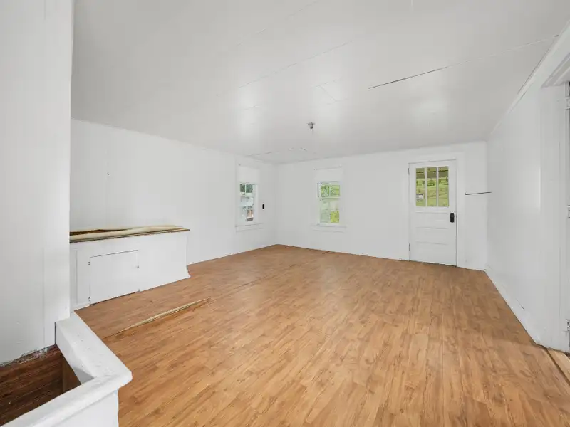 Prime 2.58-acre Multifunctional Property with Ranch Home and Outbuildings Near High-traffic Area