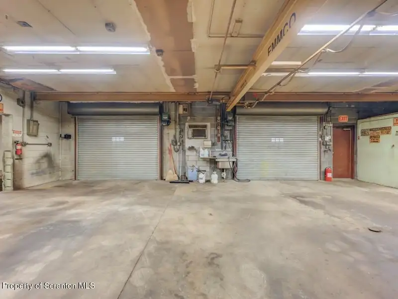 Mixed-use Property in Throop: 7-bay Garage and Updated 2-bedroom Apartment