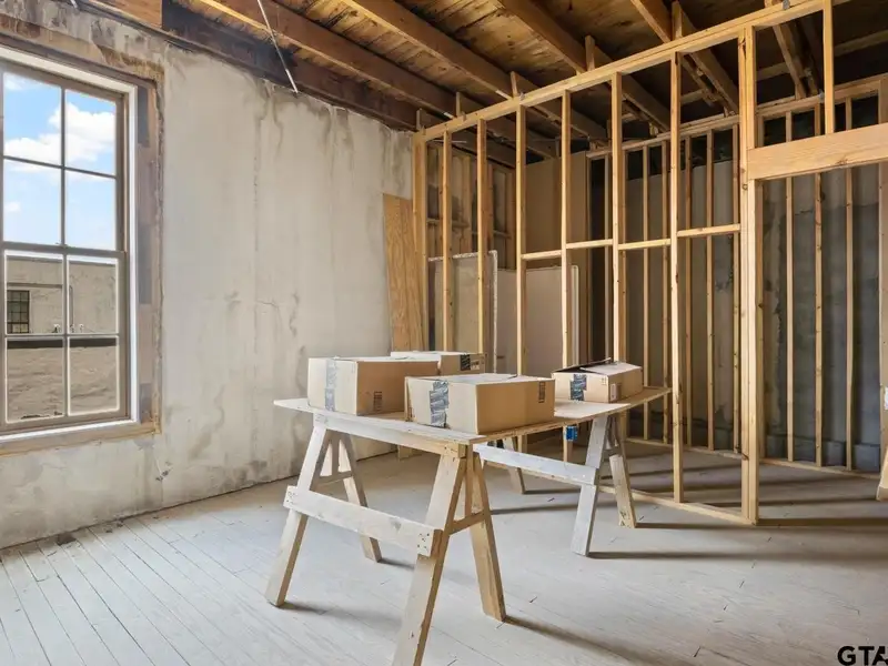 Unfinished Downtown Commercial Building with High Traffic Visibility and Mixed-use Potential