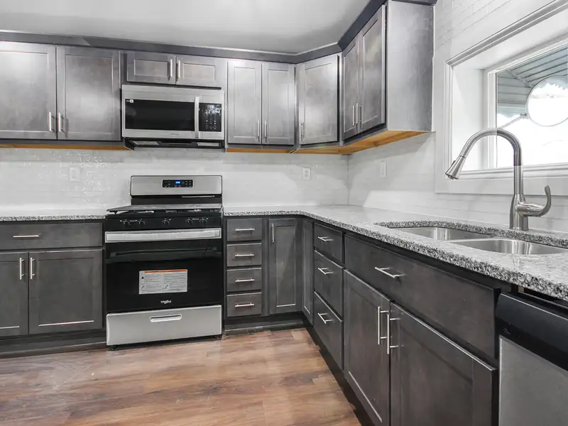 Mixed-use Two Unit Building with Remodeled Three Bedroom Apartment in Prime Location