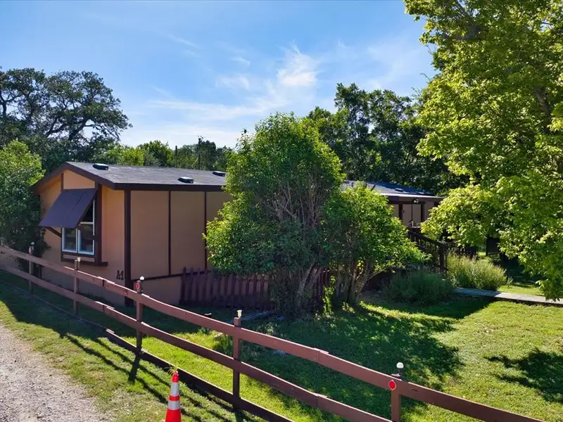 10-acre Mobile Home Community with 5 Units, Fenced, Workshop, and Growth Potential