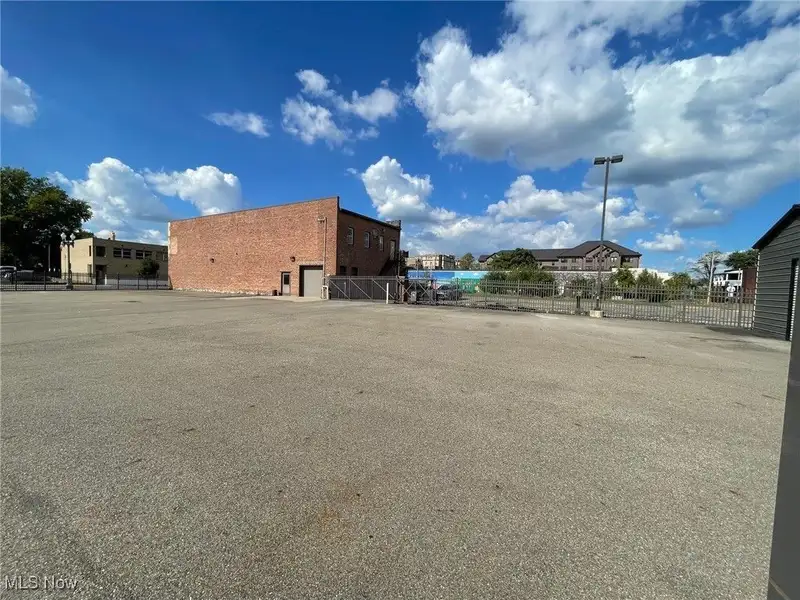 Well-maintained Two-story Brick Building with Retail and Workshop Space in Ne Location