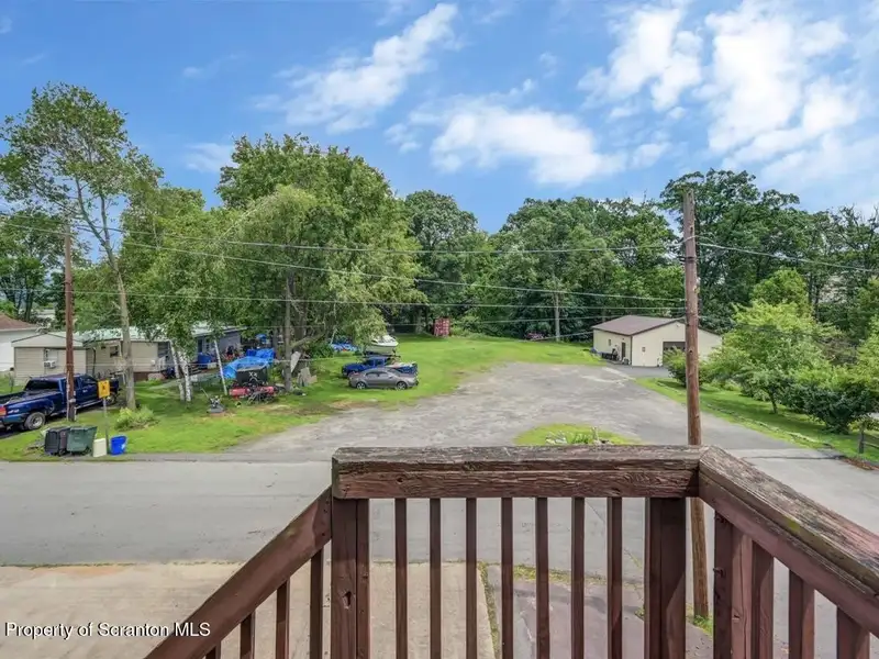 Mixed-use Property in Throop: 7-bay Garage and Updated 2-bedroom Apartment