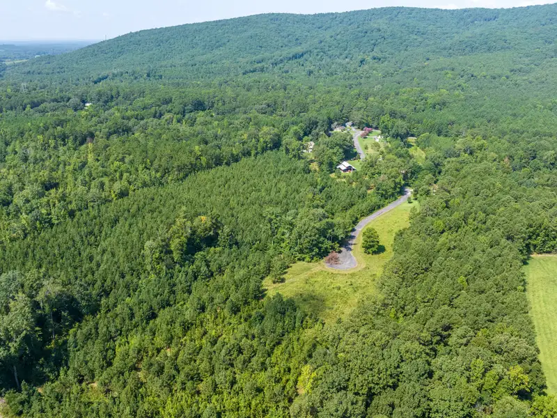 27 Acres with 2,400 Sq. Ft. Home, Duplexes, Pool, and Barn in Prime Location