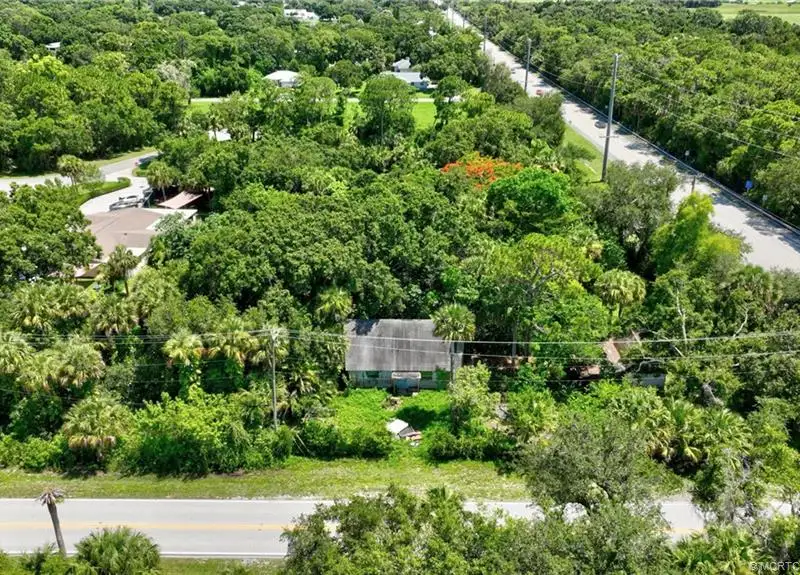 Commercial Corner Lot with Existing Residence in Lakewood Park, 31,140 Sq Ft