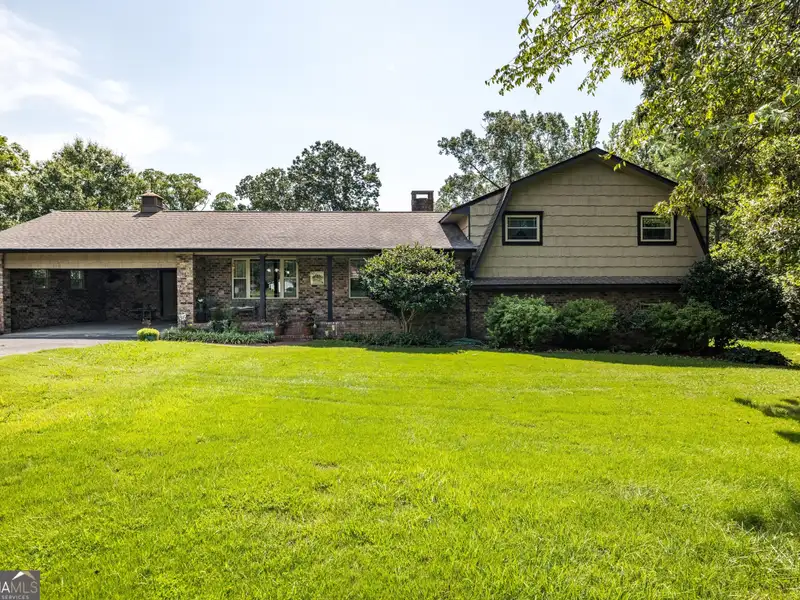 27 Acres with 2,400 Sq. Ft. Home, Duplexes, Pool, and Barn in Prime Location