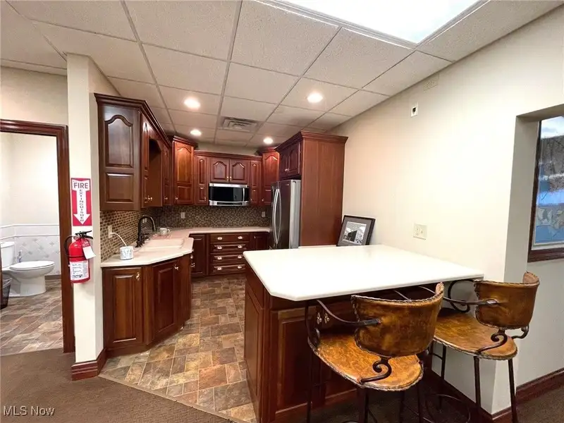 Well-maintained Two-story Brick Building with Retail and Workshop Space in Ne Location