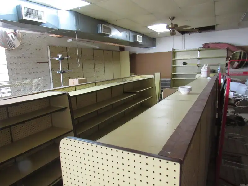 Versatile Commercial Property Near County Fair Grounds with Gas Station and Retail Potential