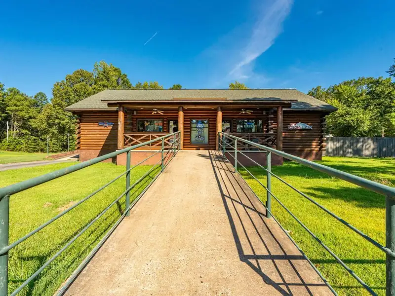 Established Log Cabin Liquor Store for Sale on Highway 70 with Drive-through Access