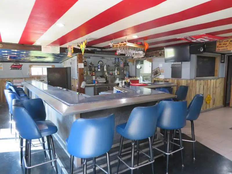 Turnkey Bar/restaurant with Apartment, Highway Access, and Development Potential in Northwoods