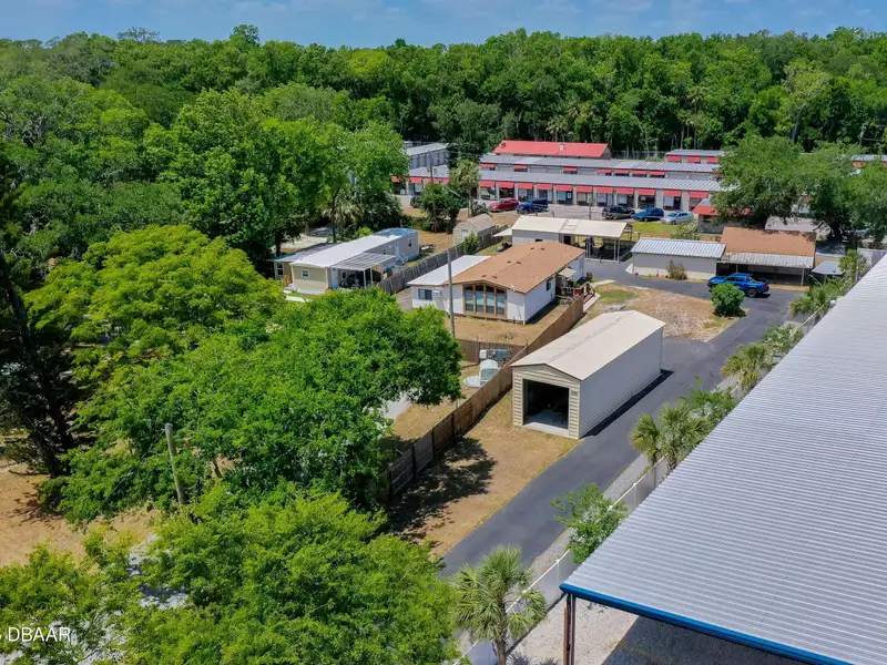 Mixed Use Property: Light Industrial Lot with Adjoining Residential Home and Expansion Potential
