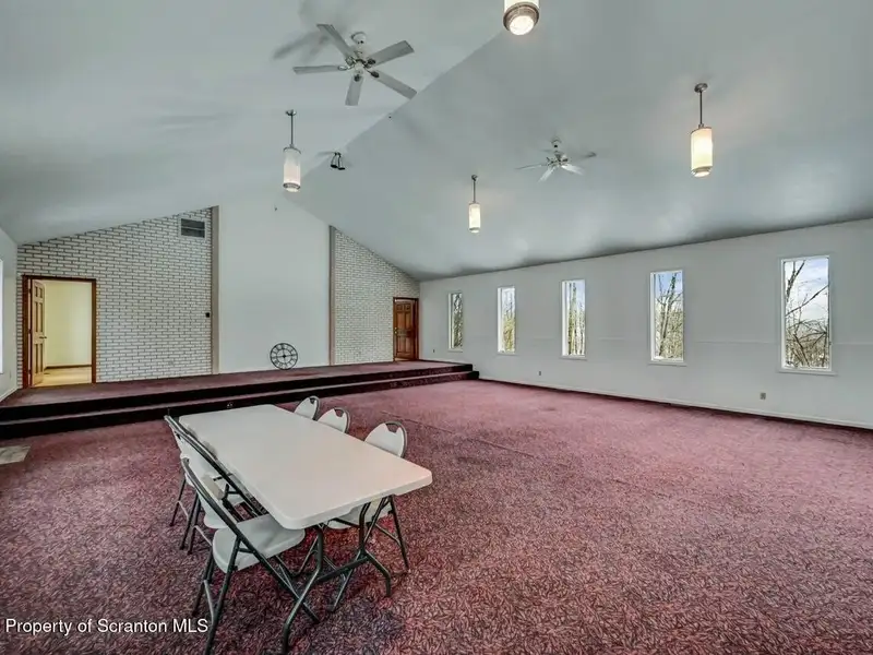 Versatile Former Church Building in Peaceful Location with Ample Parking and Creative Potential