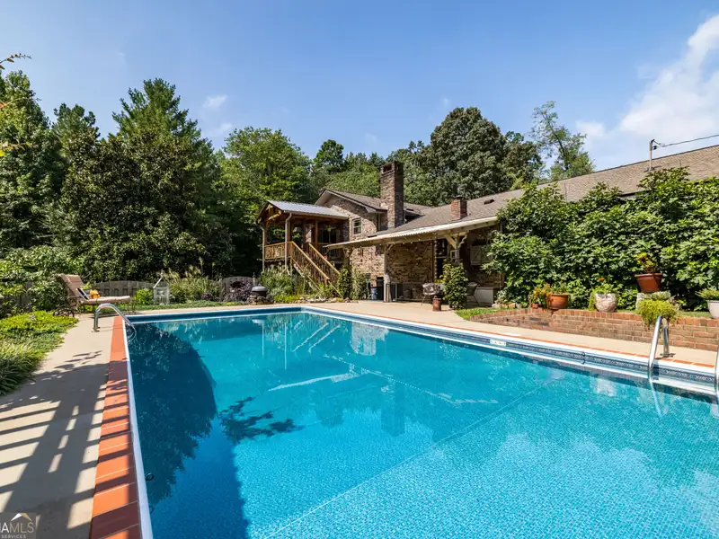 27 Acres with 2,400 Sq. Ft. Home, Duplexes, Pool, and Barn in Prime Location