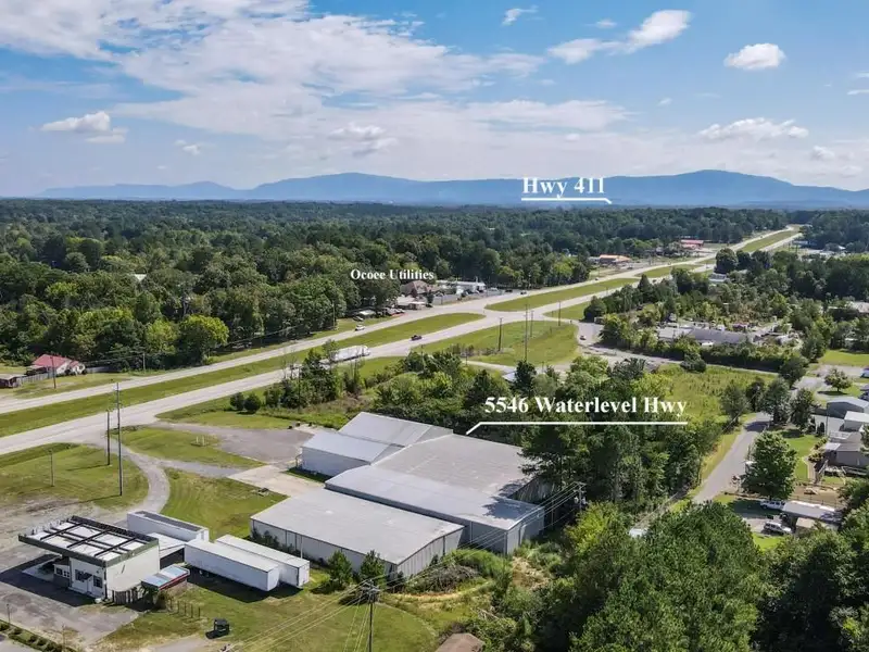 Commercial Property on Busy Highway - 2.1 Acres, 31,000 Sq Ft with Offices and Roll-up Doors