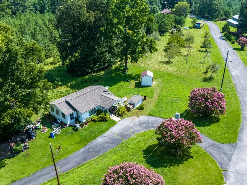 27 Acres with 2,400 Sq. Ft. Home, Duplexes, Pool, and Barn in Prime Location