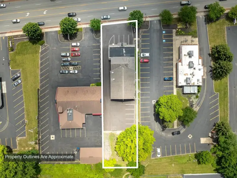 Prime Commercial Building in Downtown Reynoldsburg with Parking and Industrial Garage
