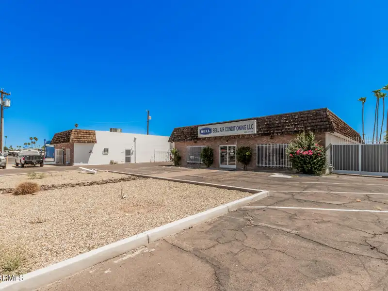 Versatile Commercial Property with Two Buildings and Ample Parking in Prime Location
