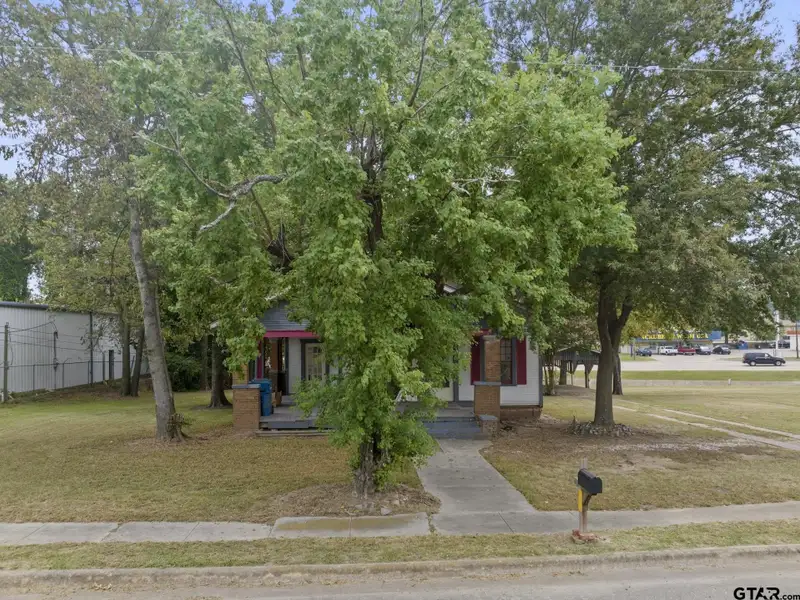 Prime Commercial Property with Building and Home on Half Acre Lot