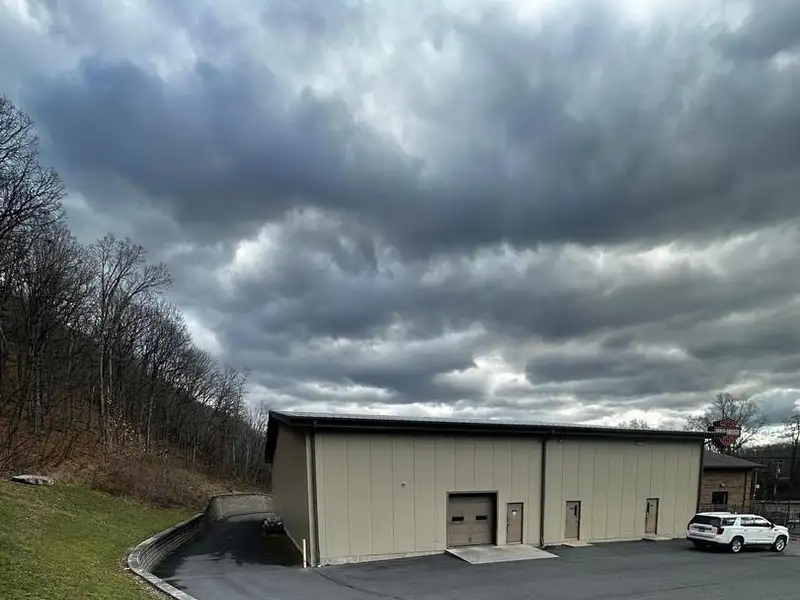 Versatile Commercial Property with Showroom, Offices, and Large Metal Building in Prime Location
