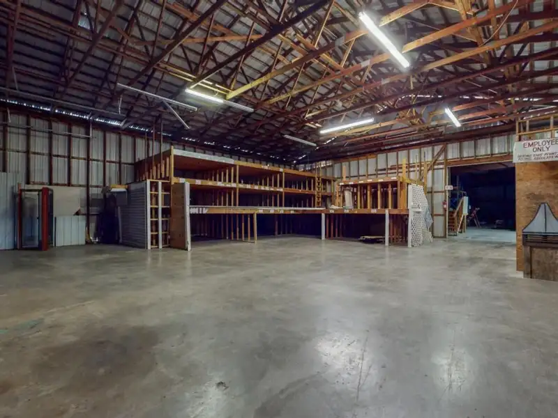 Commercial Property on Busy Highway - 2.1 Acres, 31,000 Sq Ft with Offices and Roll-up Doors