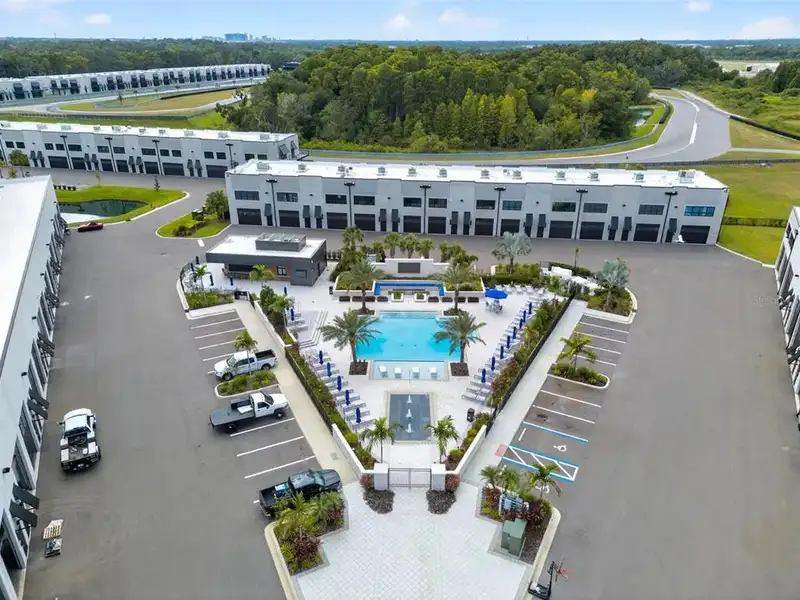 Exclusive Balcony Unit at the Motor Enclave with Private Garage and Racetrack Views