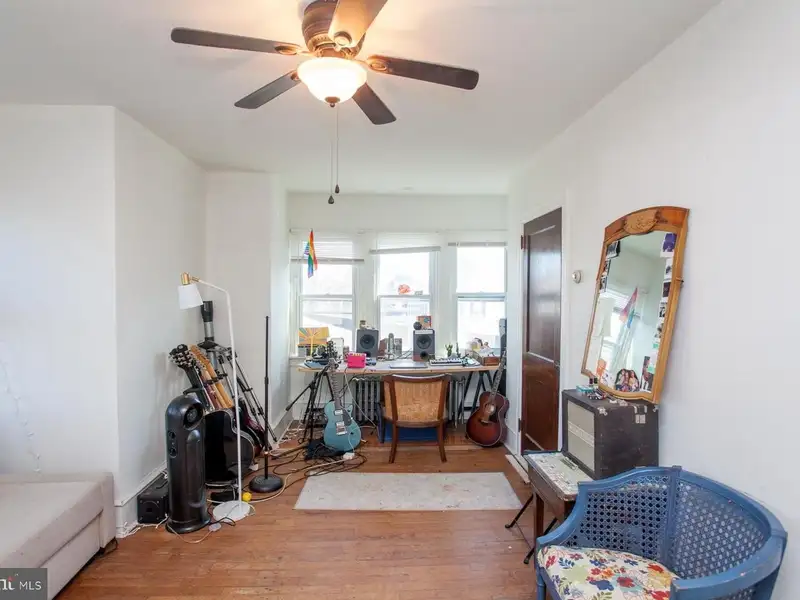 Multi-unit Building with Commercial Space and Two Residential Apartments in Established Location