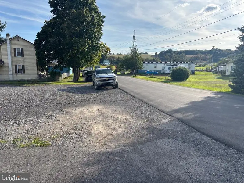 Versatile Metal Frame Building with Parking Lot in Prime Location, 0.33 Acres